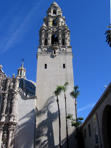 Passing through the California Quadrangle. Palm trees cast shadows on the California Tower.