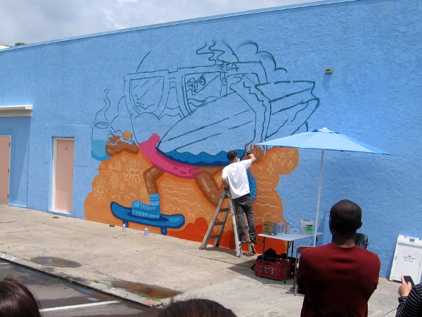 Nick McPherson (a.k.a. Nicholas Danger) paints a cool mural on a North Park wall during the 23rd Annual San Diego County Credit Union Festival of Arts.