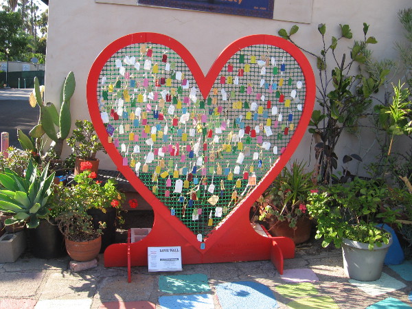 A heart-shaped Love Wall stands on the patio of the Spanish Village Art Center in Balboa Park.