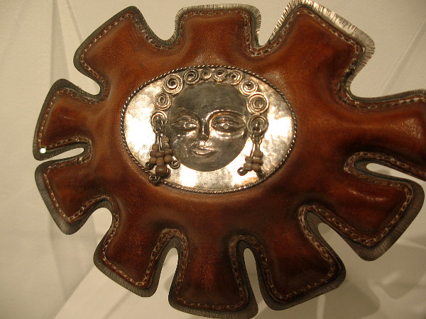 Belly Warmer, 1973, sterling silver, leather, wood. Arline M. Fisch.