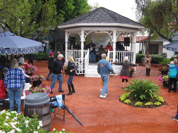 Dancing in the rain--or light, steady showers--by the gazebo in Seaport Village.