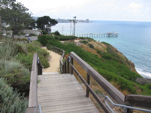 Heading down the wooden walkway with amazing views of the Pacific Ocean, Scripps Pier, and La Jolla Cove in the distance.