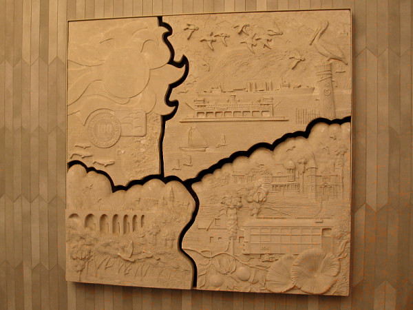 The panel on the right. It depicts many later San Diego landmarks. Images include Balboa Park, a streetcar, Coronado ferry, naval ship, farm and Victorian houses.