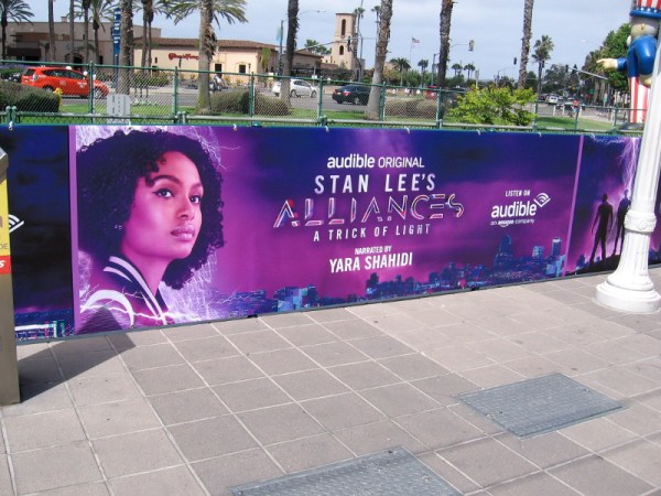 A banner is up near the Seaport Village trolley station promoting Stan Lee's Alliances on Audible.