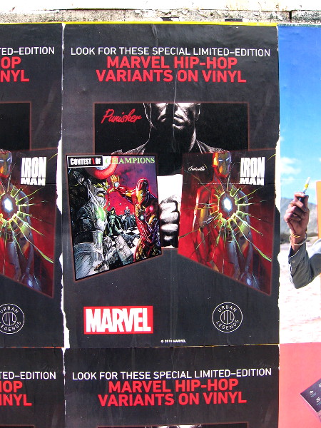 An advertisement slapped on a downtown wall for Marvel Hip-Hop Variants on Vinyl.