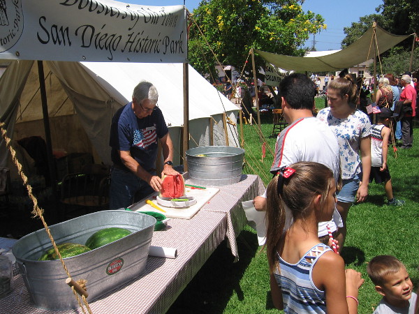 Boosters of Old Town San Diego Historic Park raise money by selling sliced watermelon and pies.