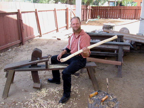 This friendly guy near the blacksmith shop was making an axe handle.
