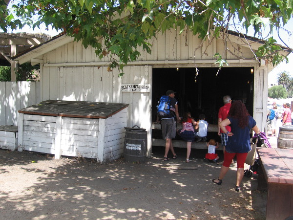 Families were peering into the active blacksmith shop.