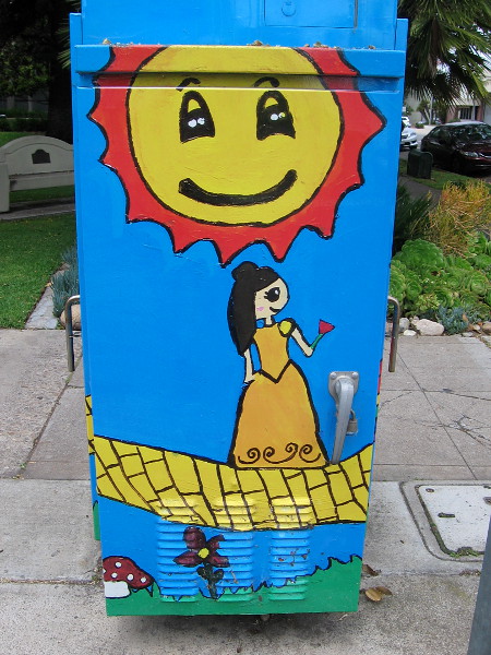 Dorothy walks along the yellow brick road as Art Outside the Box.