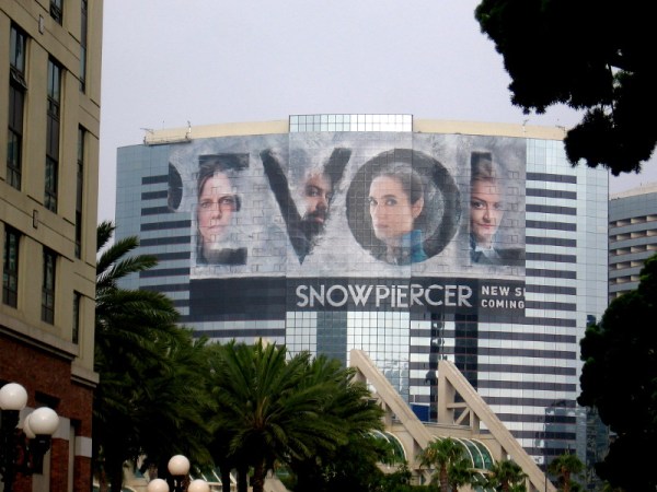 The word REVOLT appears in the Snowpiercer wrap on the Marriott Marquis.