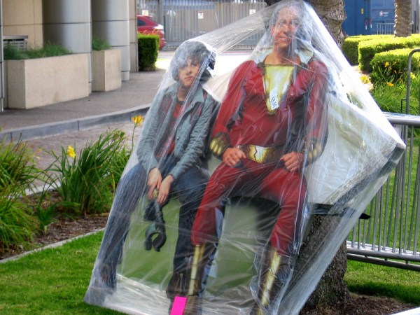 At the Warner Bros. Pictures offsite, it appears Billy Batson and Shazam have been captured by a villain with some plastic.