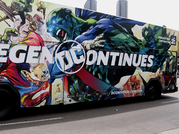 Superman and Martian Manhunter are battling it out on a passing bus!