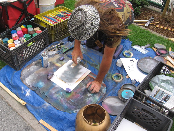 William, a cool San Diego artist, spray paints a character from South Park.