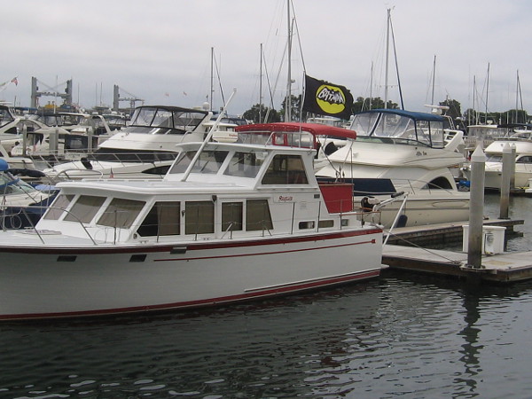 A boat in the Marriott Marina has a Batman banner flying in the wind.
