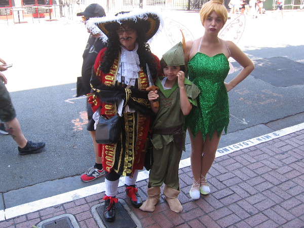 Captain Hook, Peter Pan and Tinker Bell cosplay.