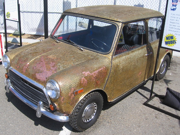 This amazing, functioning Austin Mini is covered with over 10,000 Canadian pennies, each plated with 24 karat gold!