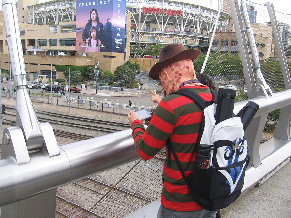Freddy Krueger checks his phone.