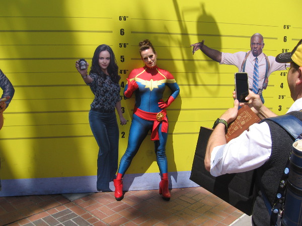 Captain Marvel in a police lineup.