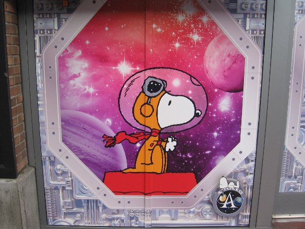Astronaut Snoopy graphic on the outside of Bubbles Boutique in the Gaslamp Quarter, where the Peanuts Pop-Up Shop is located during Comic-Con.