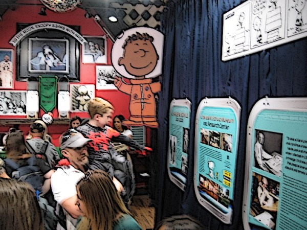 A look inside the Peanuts Pop-Up Shop at two walls of the exhibit. (My photo was blurry so I changed it into a fun cartoon!)