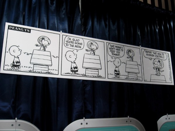 One of two Peanuts comic strips on display. Snoopy won't need dinner now that he's heading to the moon.