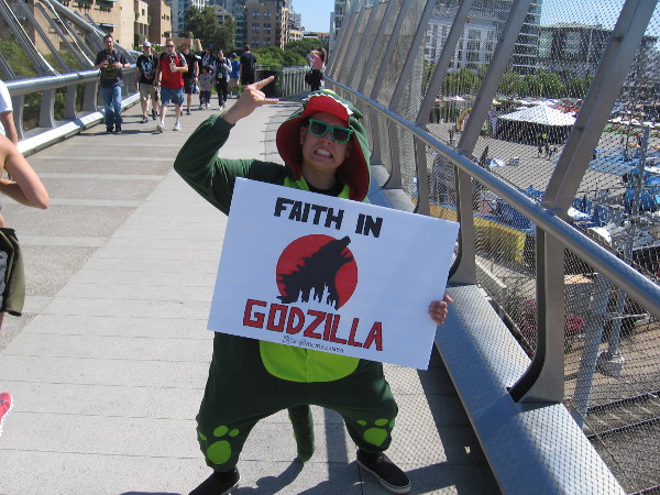 A fanatic demonstrates their unquestioned FAITH IN GODZILLA.