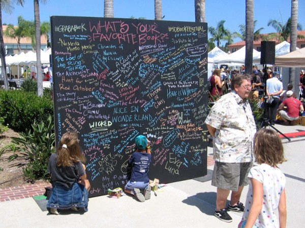 Visitors to the festival could write the title of their favorite book on this big chalkboard.