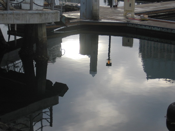 Strange reflections on the smooth water of Tuna Harbor.