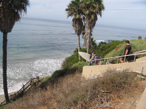 Descending steps to the public beach far below.
