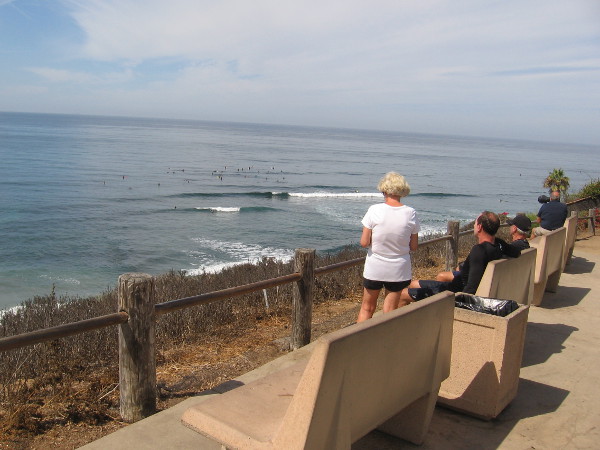 Benches above the bluffs allow people to watch the surfing action at Swami's internationally famous point break.