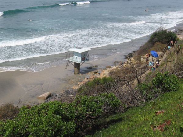 Lifeguard tower 19 near the north end of San Elijo State Beach in Cardiff rises above wet sand.