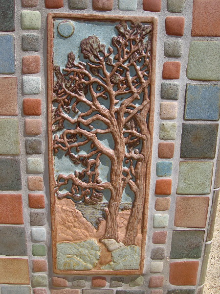 Some sculptural Torrey Pine artwork on the side of the monument.