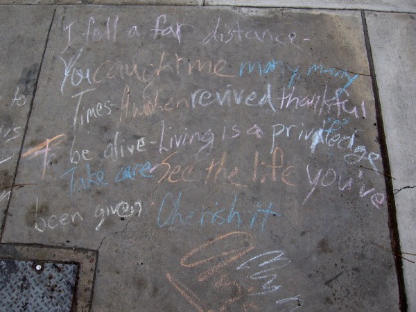Grateful words. A chalk poem on a sidewalk.