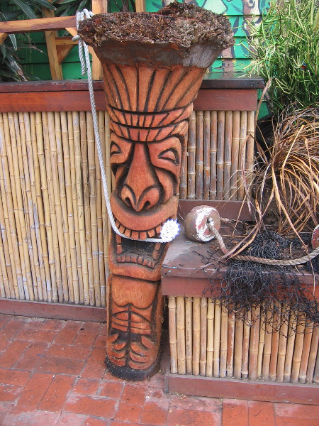 This fierce tiki likes to gnaw on rope, it seems.