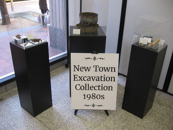 Artifacts on display include the New Town Excavation Collection from the 1980s.