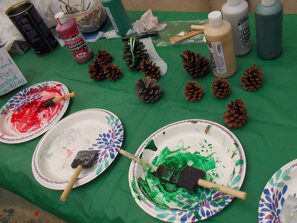 Painting pine cones in Christmas colors!