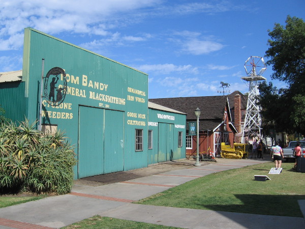 As we continue down the Heritage Walk, the Penner Barn and nearby windmill come into view.