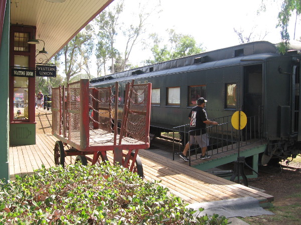 Parked next to the depot's passenger platform is railroad car number 92, built by the Pullman Company in the 1920s.