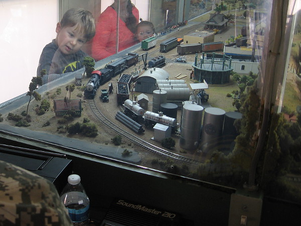 Inside the railroad car is a huge model train layout that kids love!