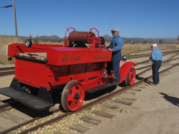Here comes the San Diego & Arizona Eastern MW 1003 1931 Ford Model AA Rail Fire Engine.