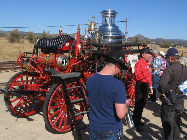 Visitors to the event check out a working 1902 American steam fire engine.