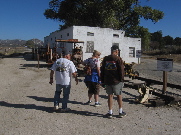People check out some of the railroad equipment on display on the museum grounds.