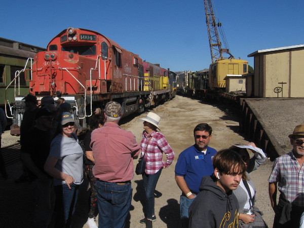 People were lined up for lunch near some of the Pacific Southwest Railway Museum's many outdoor railroad cars.
