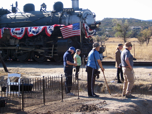 Photographers record history from one side of the gold spike reenactment.