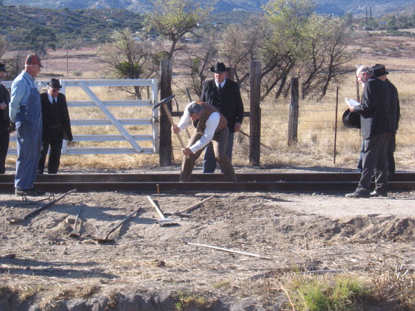 John D. Spreckels, creator of the San Diego and Arizona Railway, hammers the final spike.