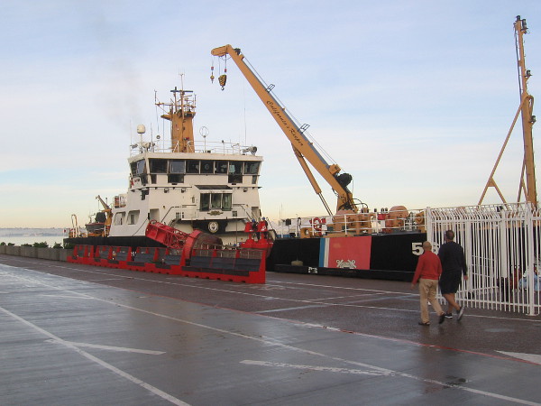 A United States Coast Guard buoy tender is docked at Broadway Pier.