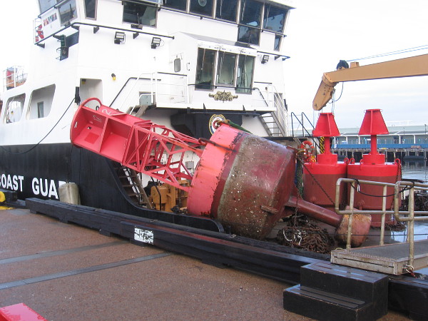It appears a navigational buoy is being replaced in the bay, or the ocean off San Diego. A very unusual sight!