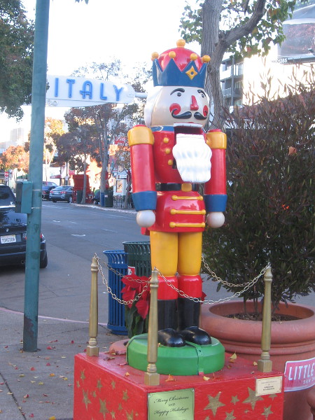 A colorful nutcracker on India Street near the Little Italy landmark sign.