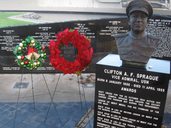 The bust of Vice Admiral Clifton Sprague, and two holiday wreaths, on The Greatest Generation Walk in San Diego.