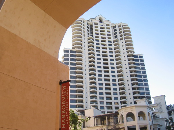 The distinctive Park Place condo building appears through an archway.